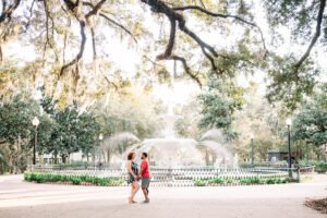 engagement photos in front of the fountain in forsyth park in savannah