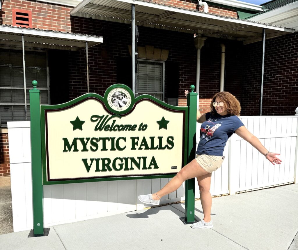 me in fron of the welcome to mystic falls virginia sign