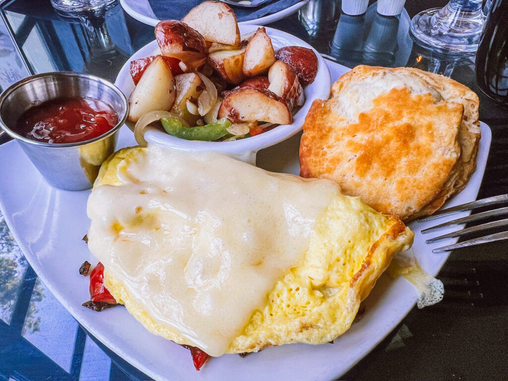 omelette with biscuit and home fries
