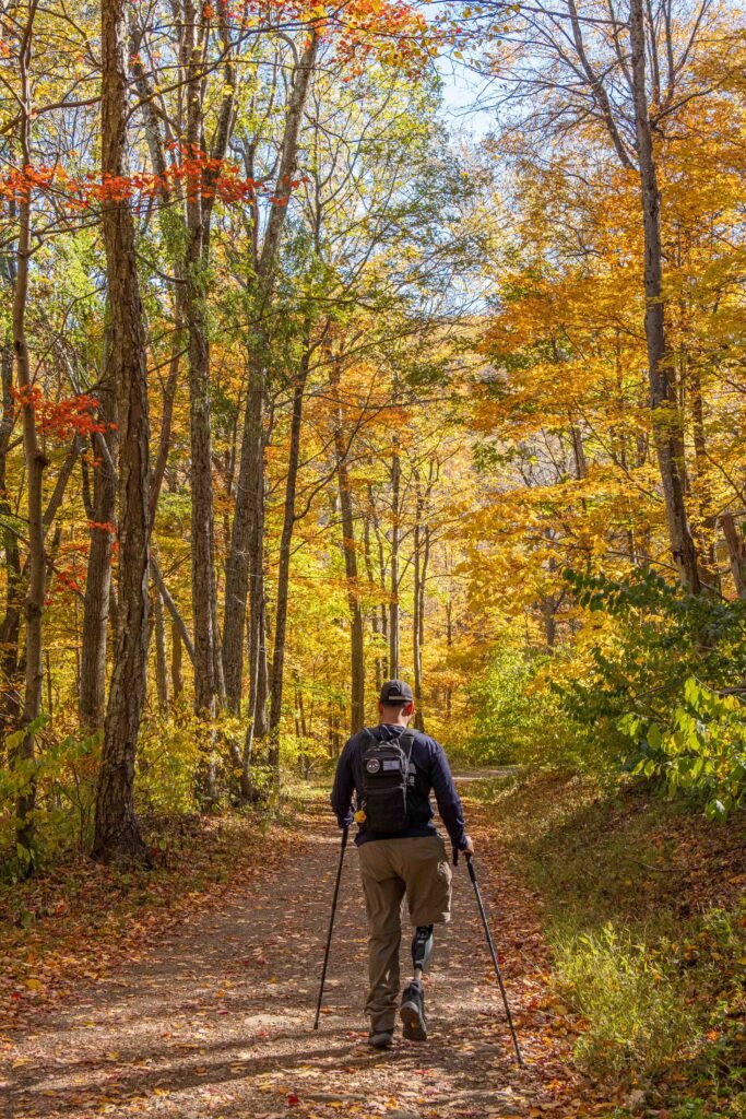 an amputee hiking in shenandoah national park in the fall season