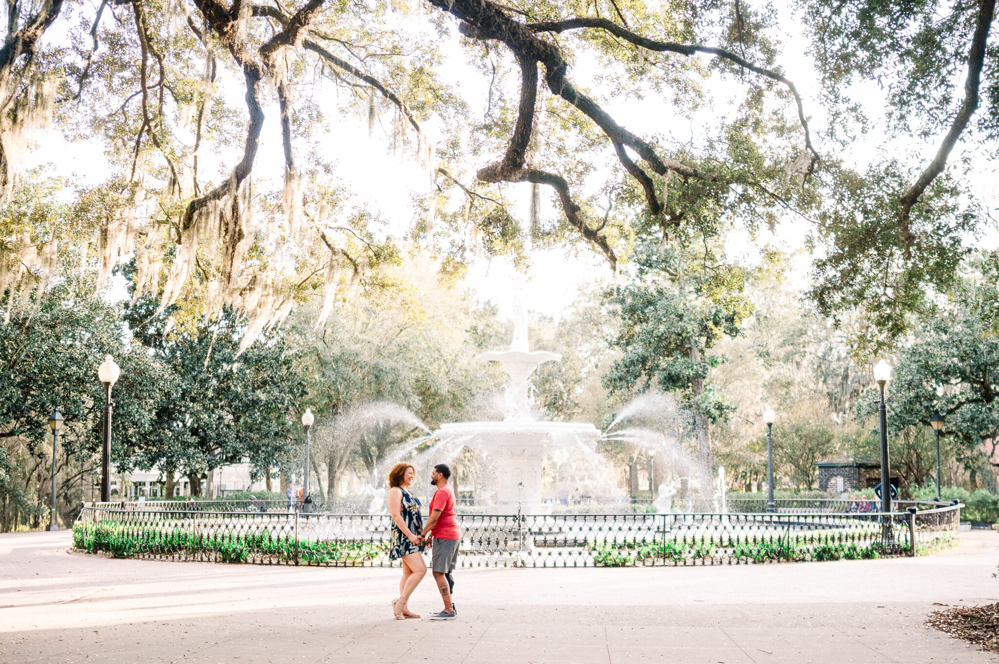 engagement photos in front of the fountain in forsyth park in savannah