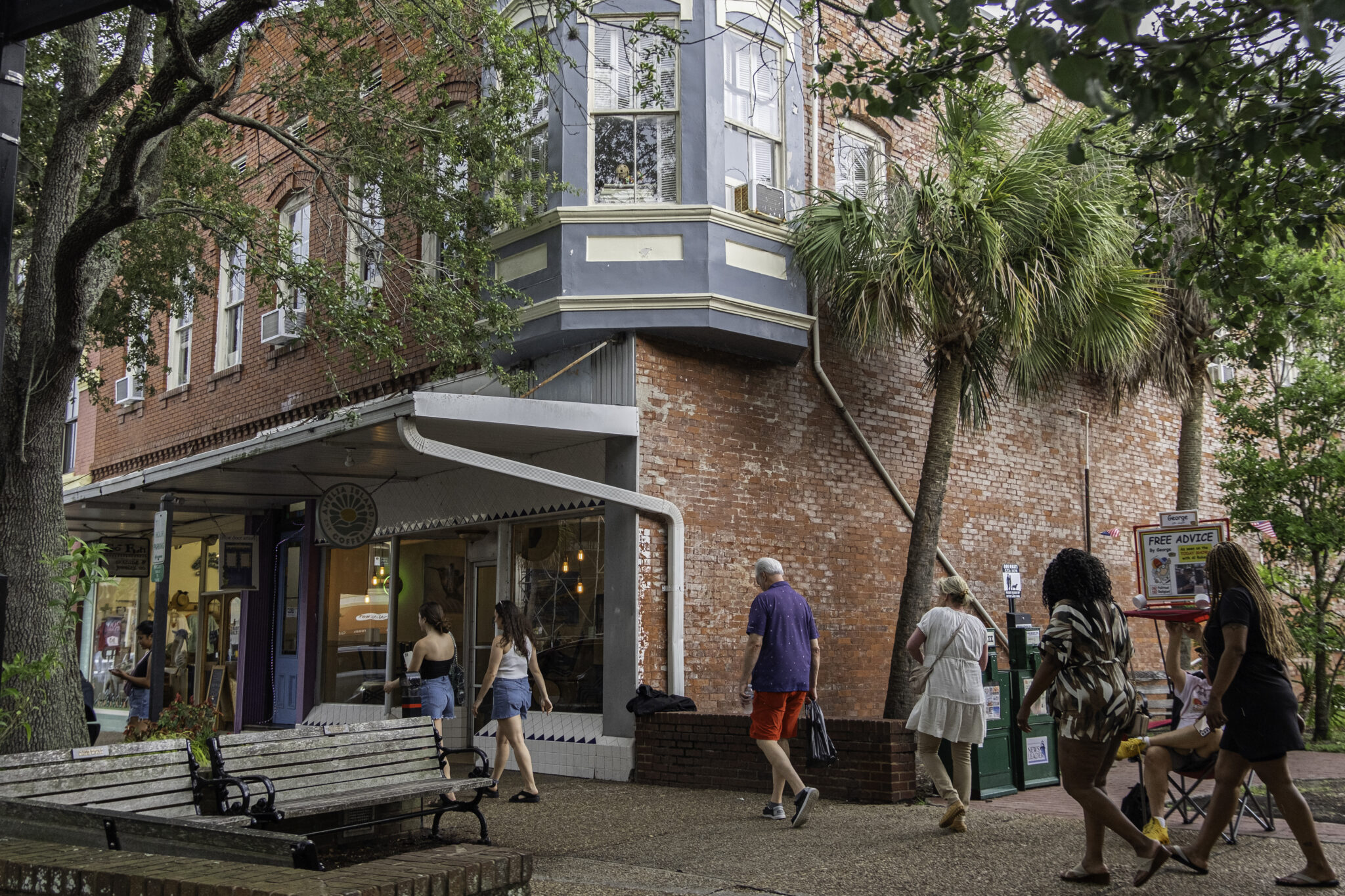 tourists walking in the main street of one of the historic small towns in florida