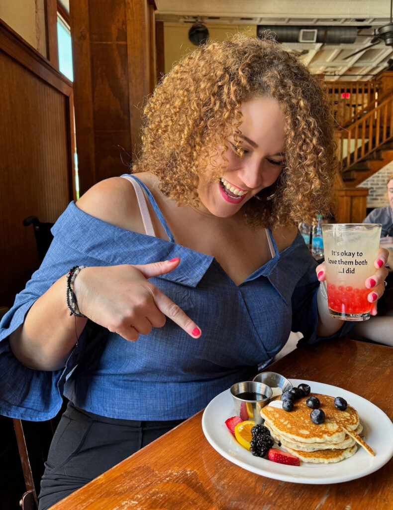 me excited for Damon's Prison World Pancakes that I ate for brunch at Mystic Grill and holding the Vampire Diaries souvenir cup