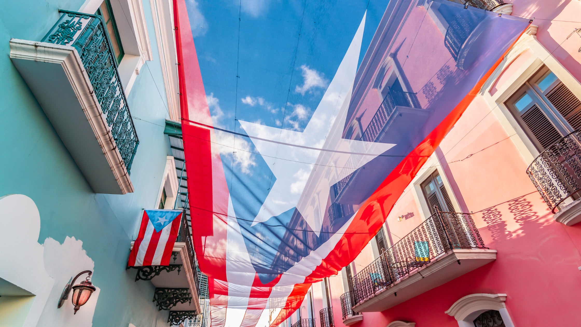 Puerto Rican Flag over a street in Old San Juan