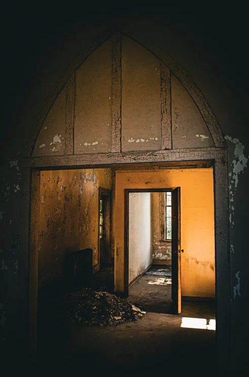 Interior view of doors inside one of the abandoned buildings at Central State Hospital, showing the scale of the facility that once housed up to 14,000 patients.
