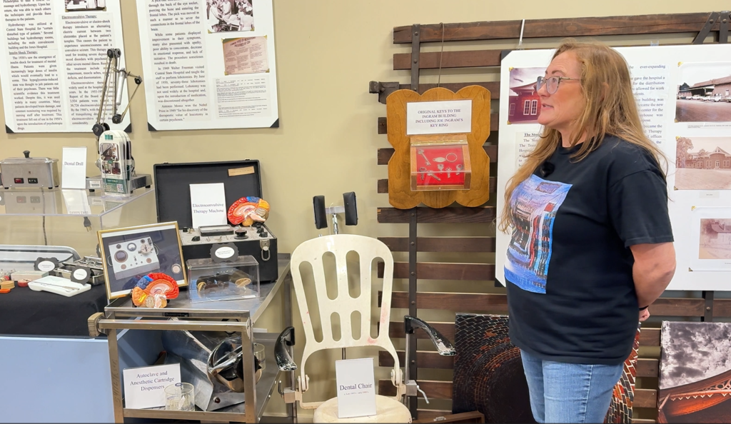 Jessica Whitehead, author and museum director at Central State Hospital Museum, standing in front of artifacts and exhibits that preserve the stories of patients who lived at the world's largest psychiatric hospital