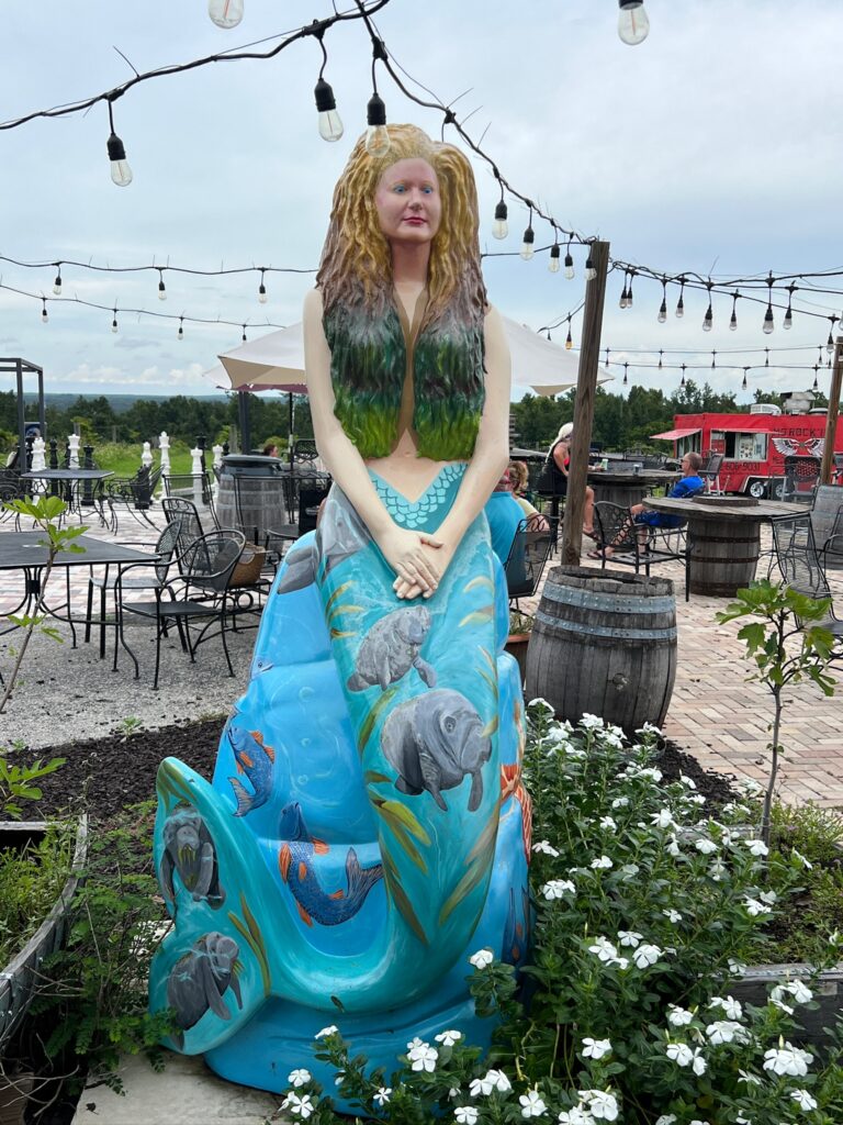 Mermaid statue at Sparacia Witherell Winery in Brooksville, Florida, part of Hernando County's Mermaid Tale Trail honoring nearby Weeki Wachee Springs.